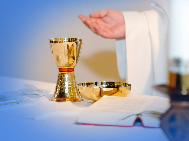 Priest with Communion